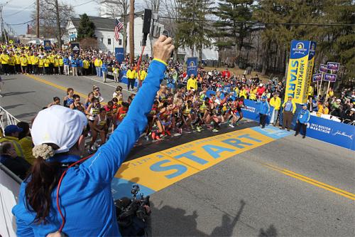 Jacqueline Benson shoots the starting piston for the elite womens start of the 117th running of the Boston Marathon